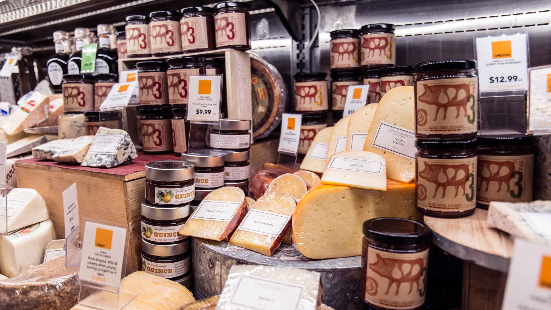 fancy cheese display in the cheese department of Zupan's Markets