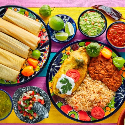 Tamale with corn leaf and filled chili pepper