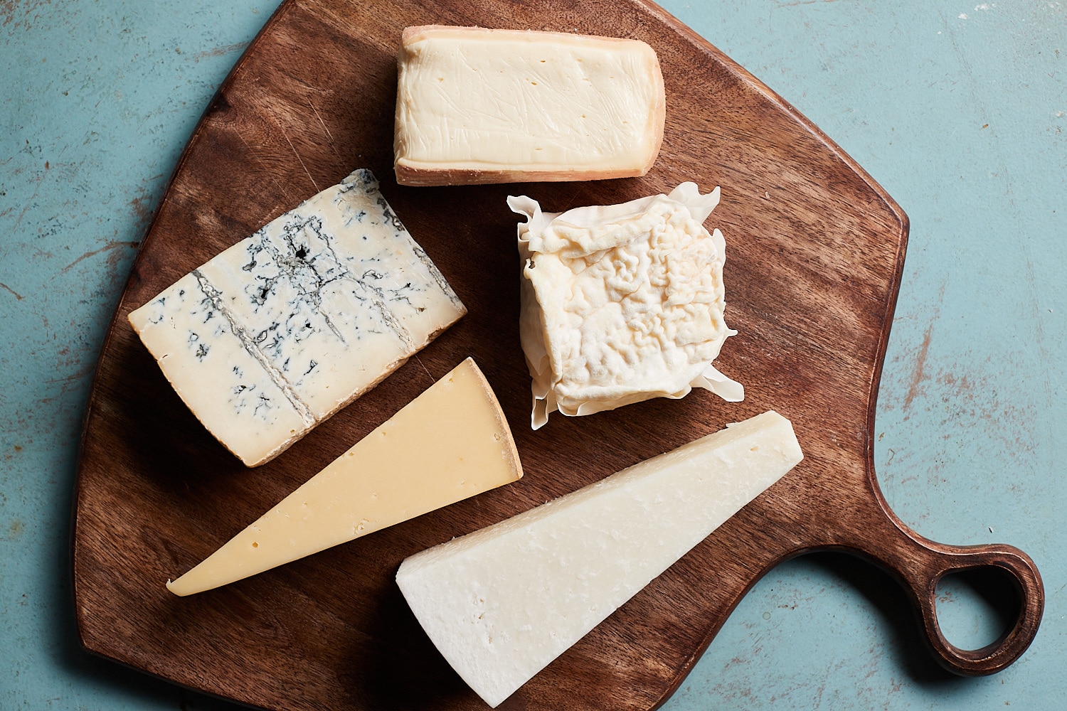 5 different Italian cheeses on a cutting board, all from Zupan's