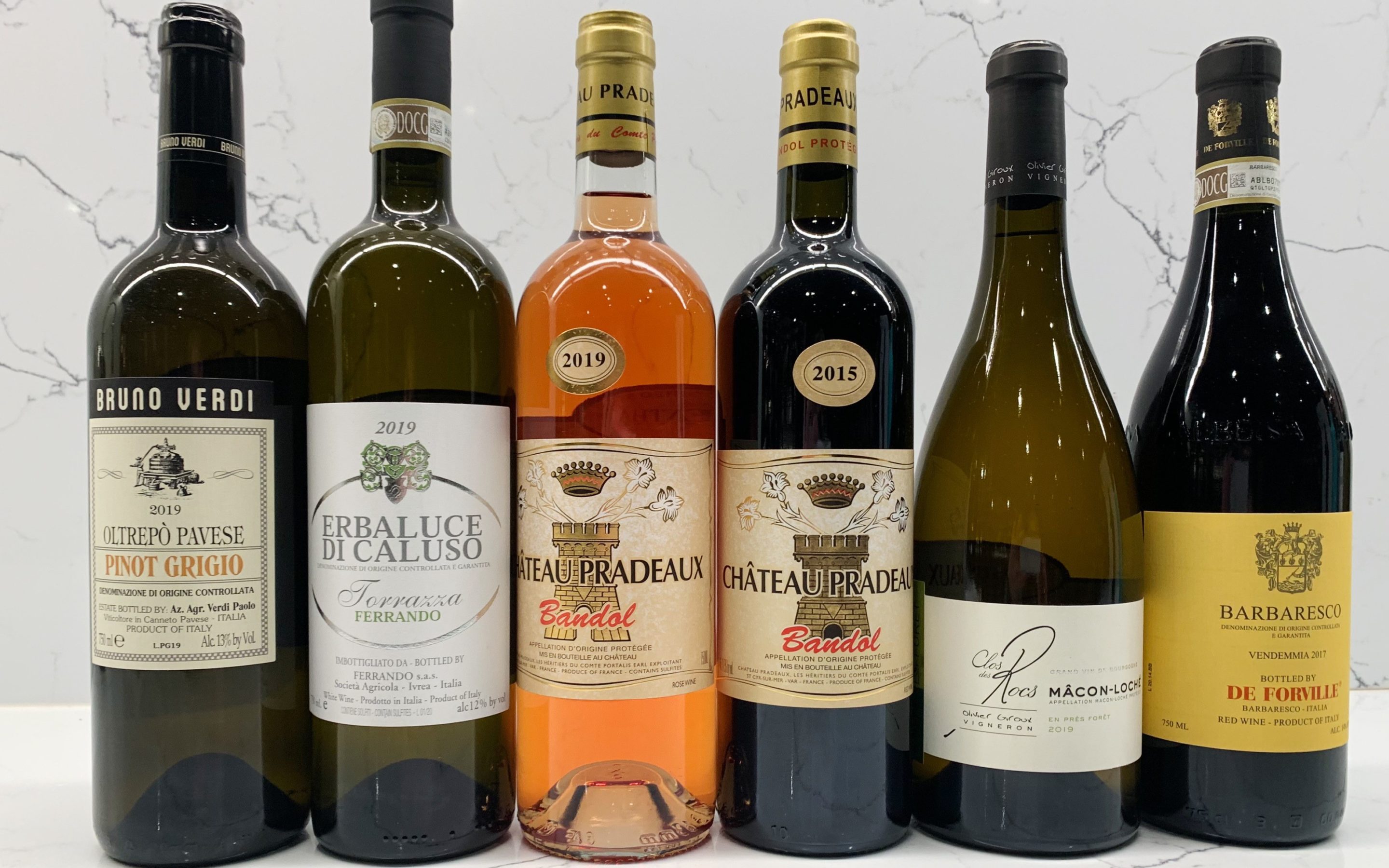 6 wine bottles lined up for a wine tasting at Zupan's Markets
