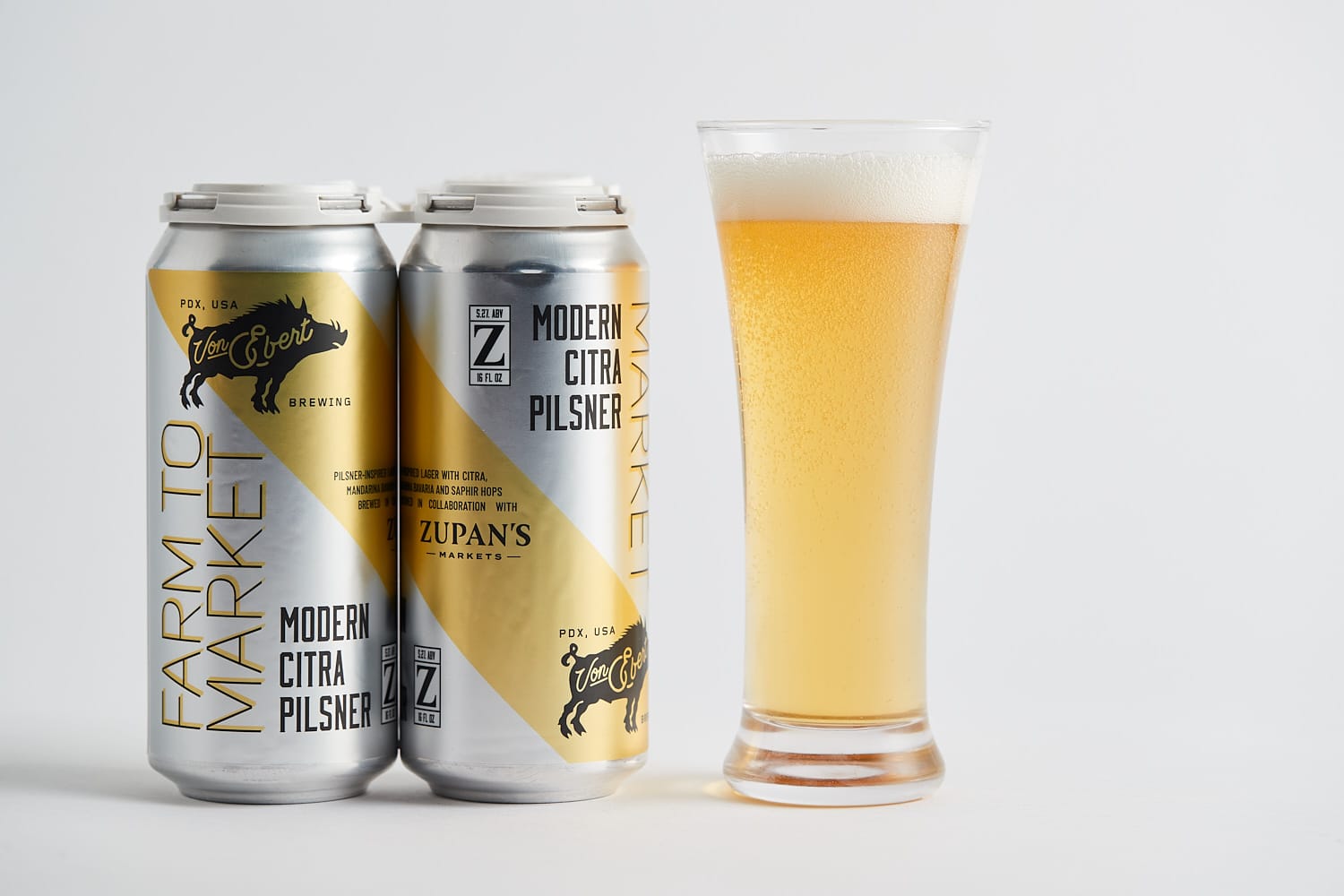 a four pack and a glass of Farm to Market Pilsner from Von Ebert