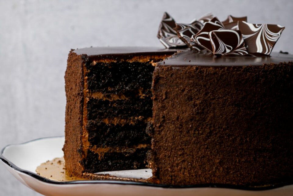 guinness stout cake with a slice cut out