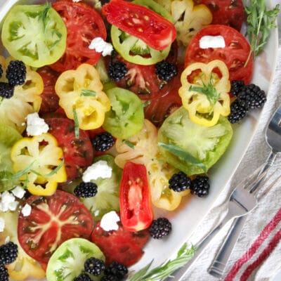 photo of an heirloom tomato salad with blackberries