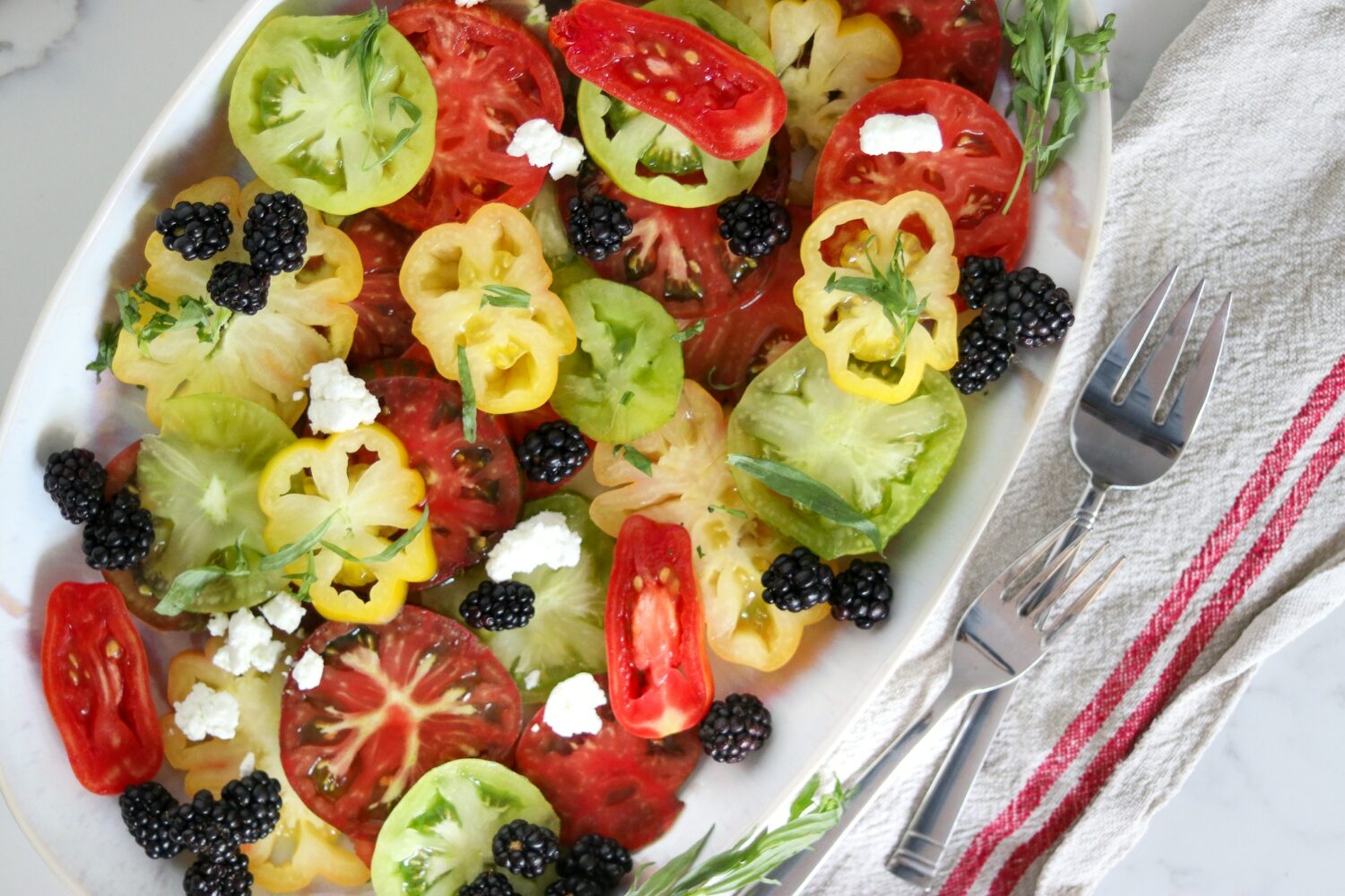 photo of an heirloom tomato salad with blackberries