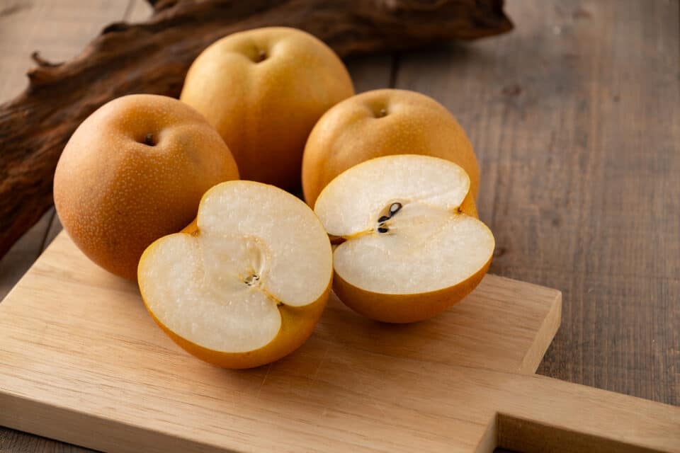 Sliced Japanese pears on a cutting board