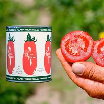 SMT canned tomato can and a hand holding a sliced tomato