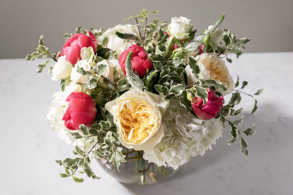 flower arrangement with white and red flowers