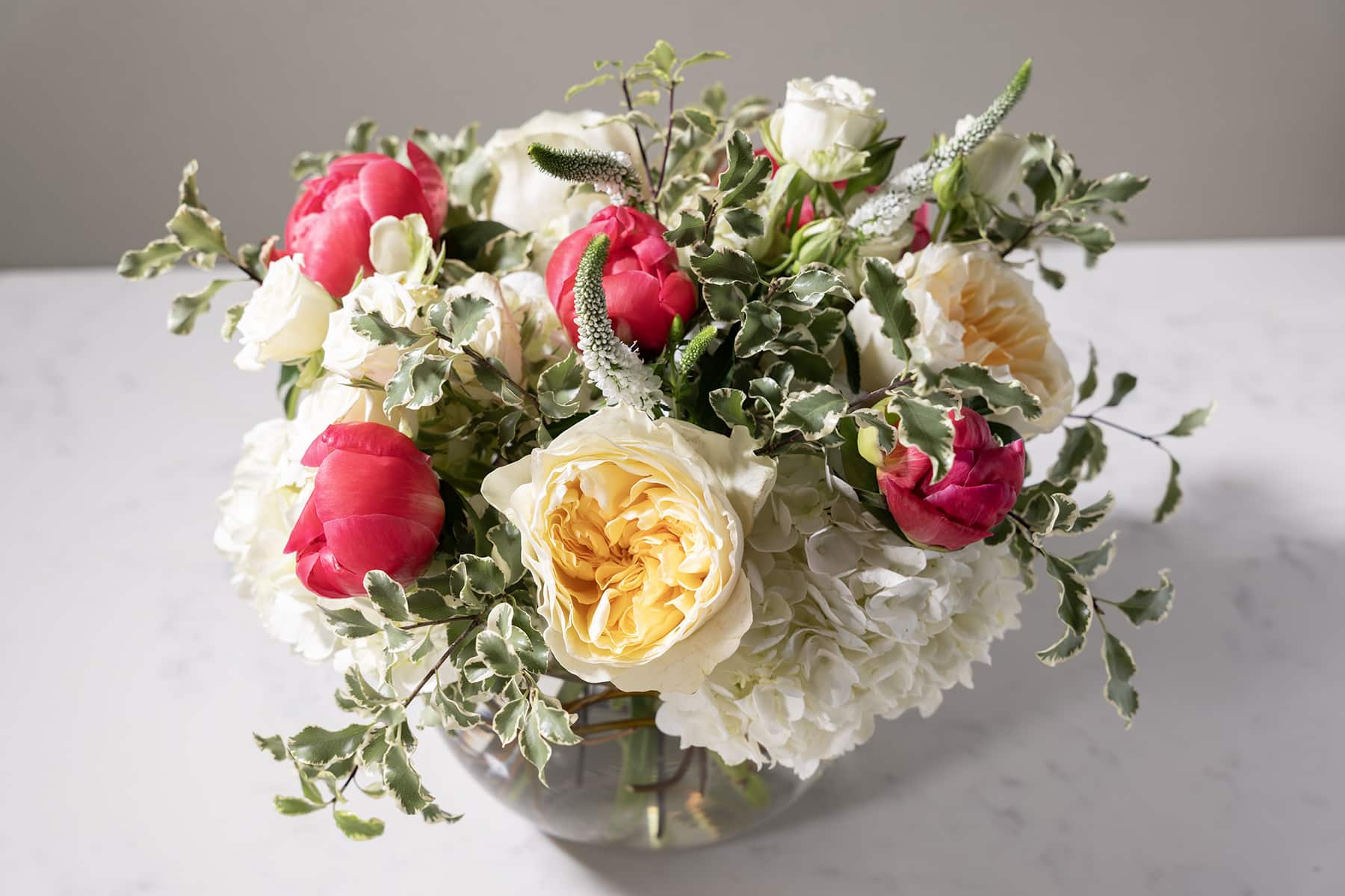 flower arrangement with white and red flowers
