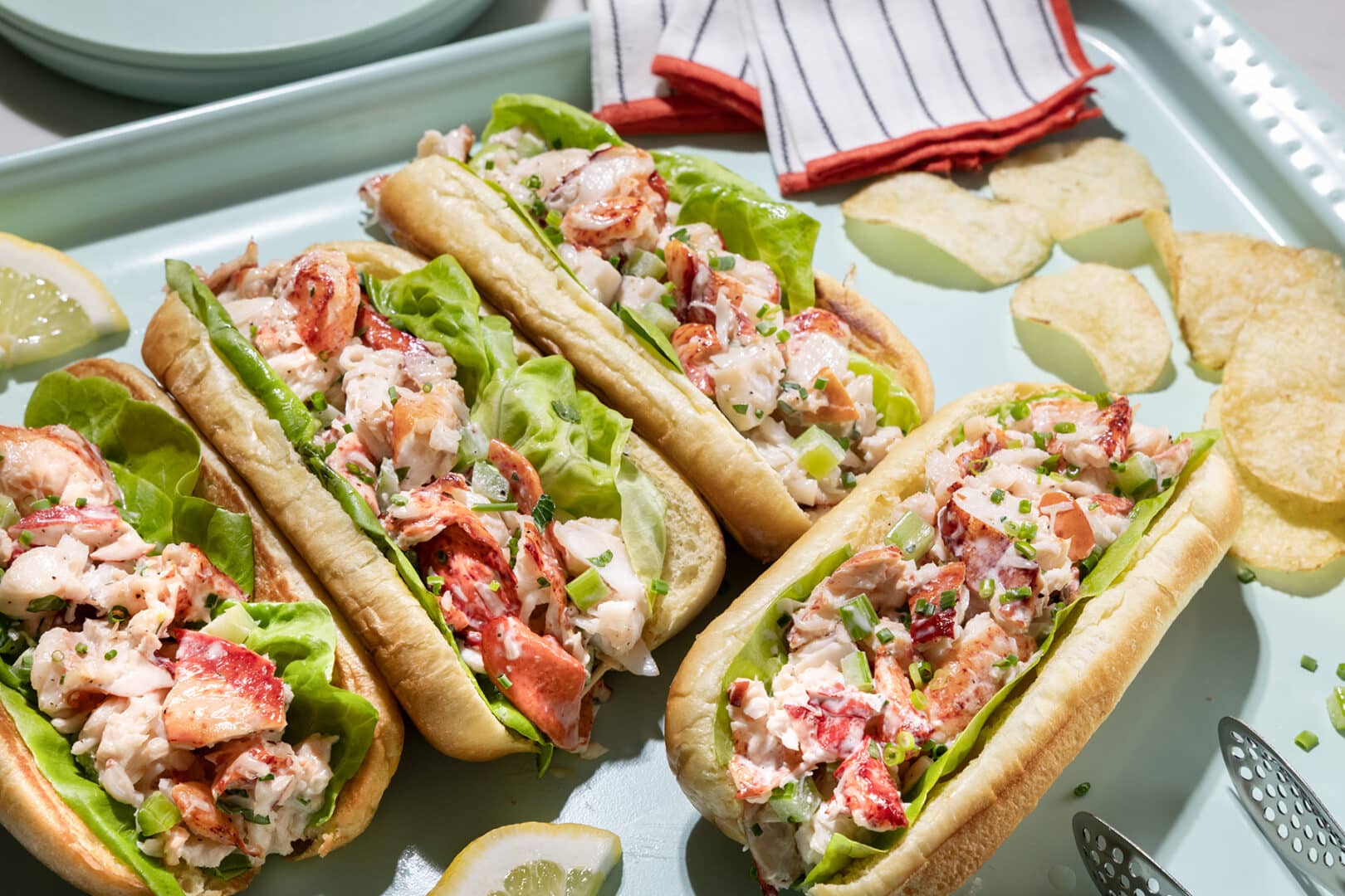 Lobster Rolls on a tray with potato chips