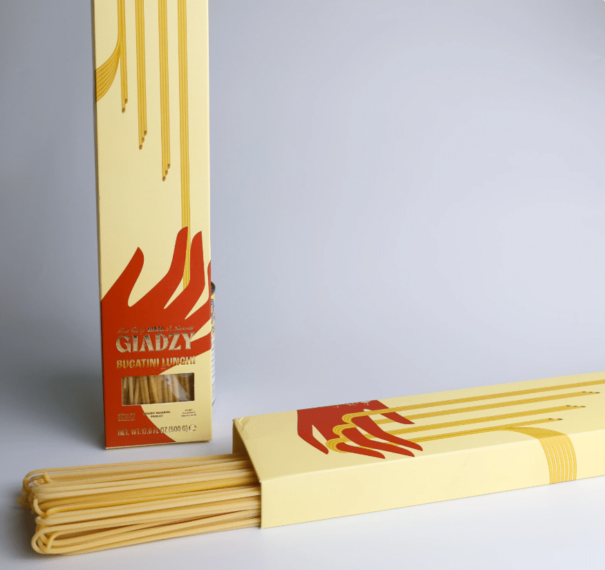 Giadzy Bucatini pasta in its packaging on a grey background